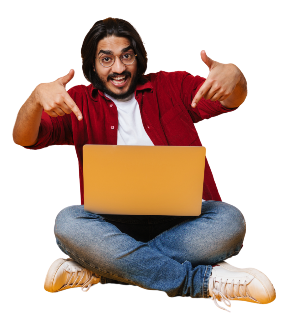 Excited young man sitting cross-legged with a laptop, pointing down enthusiastically as if saying “Your best loan deal is right here!"